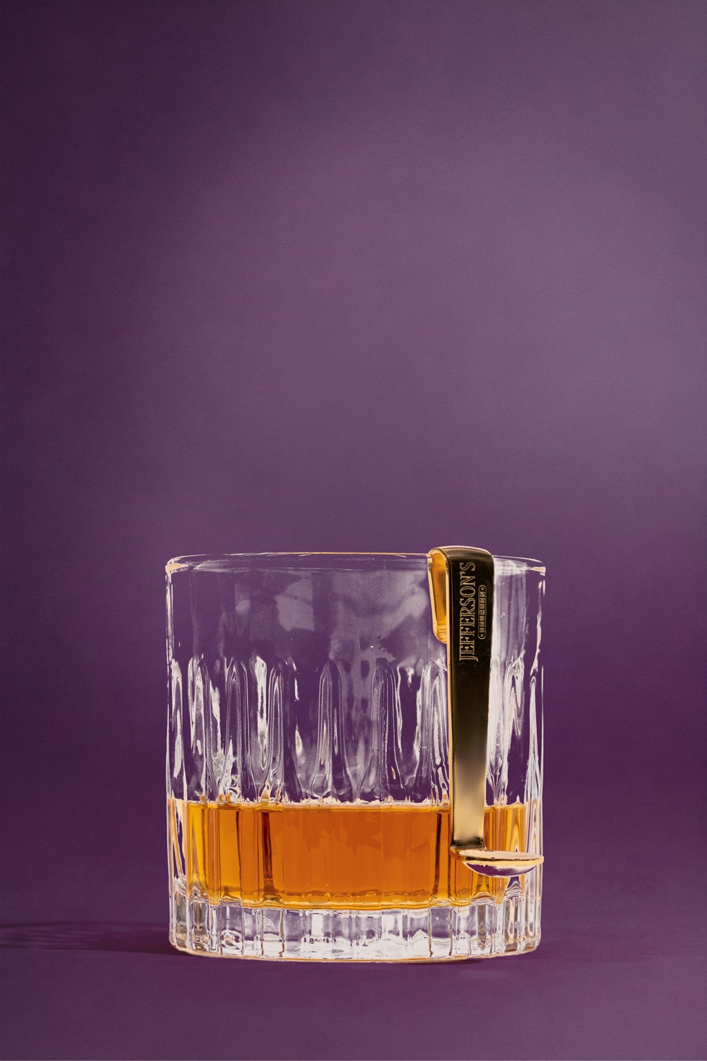 Caviar Side Car Spoon hanging from a rocks glass
