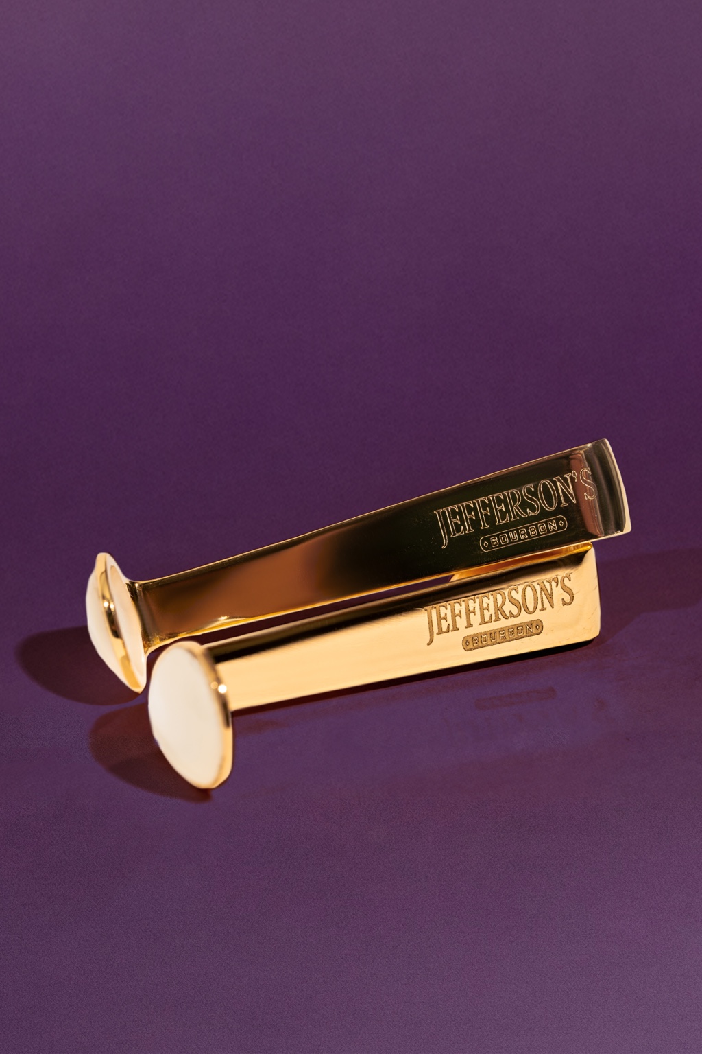 Two engraved gold plated caviar side car spoons